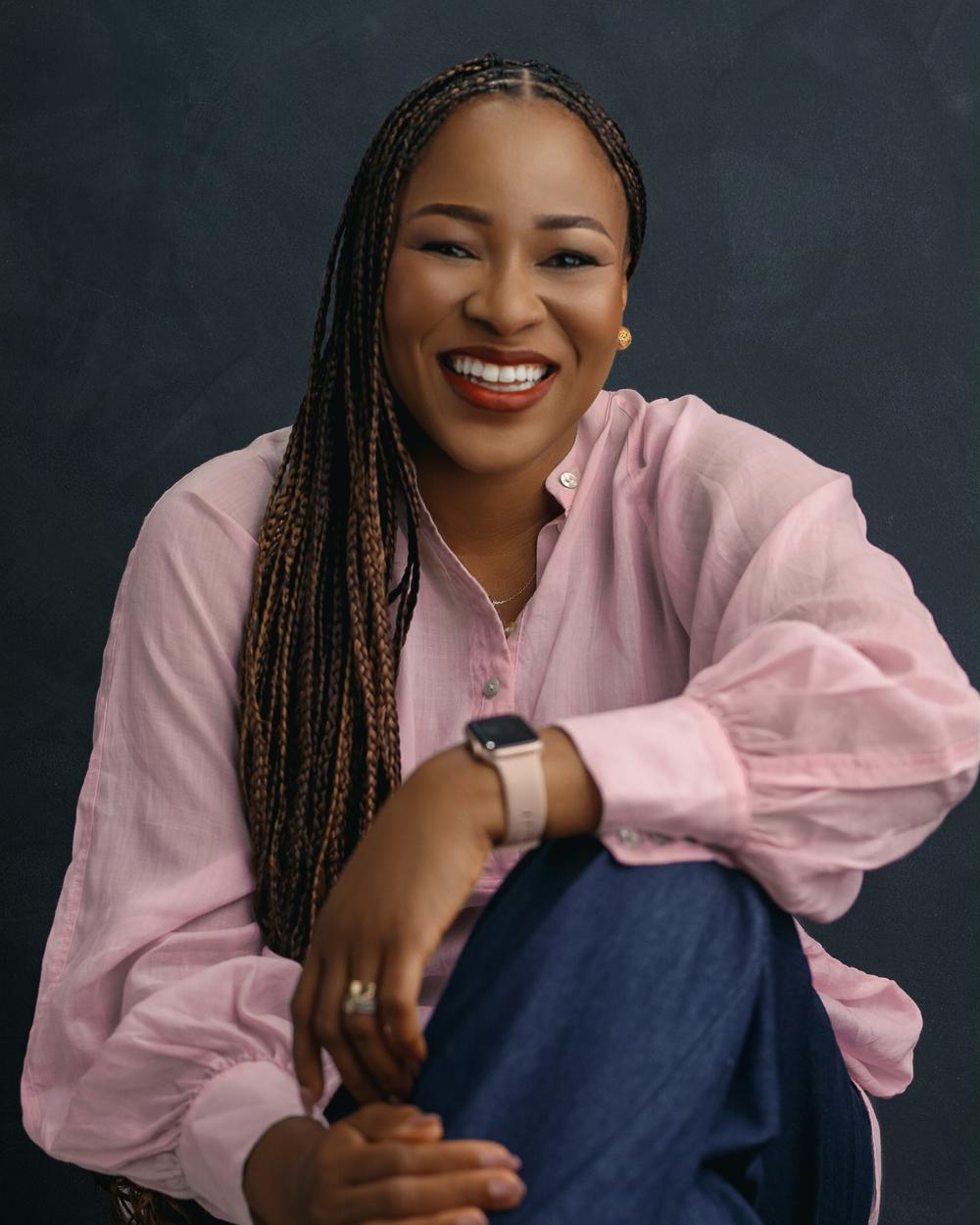 Maria Ofori-Mensah, Head Chef & Founder of GourmetMaria, smiling in a portrait photo